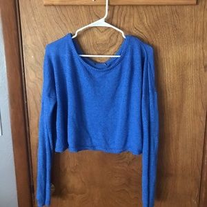 Women's cropped blue sweater.
